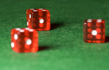 Casino dices on green cloth. The concept of online gambling.