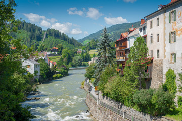 Fototapeta na wymiar Riverside scenery in Murau. Murau is a historic town in Upper Styria in the valley of the Mur in Austria.