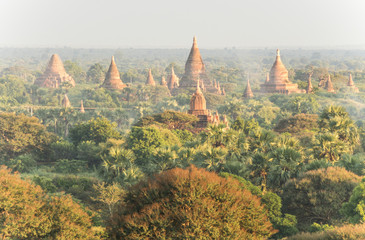 morning myst at bagan field in myanmar with pagodas 