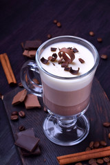 Layered dessert in an Irish glass mug with coffee and chocolate