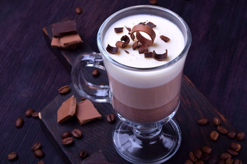 Layered dessert in an Irish glass mug with coffee and chocolate