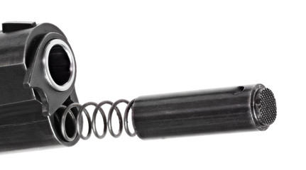 Handgun with spring and plug