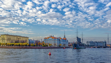 Fototapeta premium Revolutionary ship-museum Cruiser Aurora on the Neva river. The Nakhimov Naval School, St Petersburg, Russia.