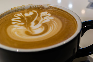 Close up of a foamy latte at an espresso bar