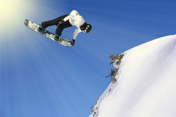 Snowboarding Snowboard Snowboarder at jump mountains at sunny day