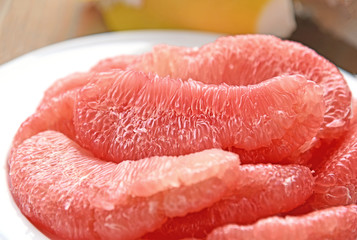 A lot of Pink Pomelo without peel on white dish