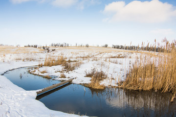 winter landscape with lake and sky