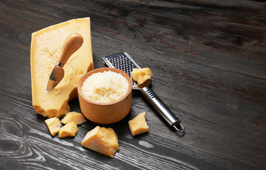 Parmesan cheese on wooden board