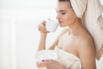 Young attractive woman after bathing in the morning