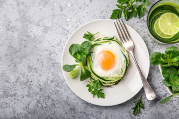 fried egg in zucchini noodle nest