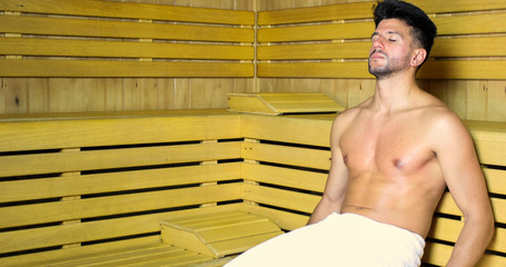 Man relaxing in a sauna