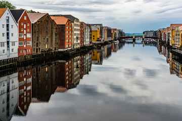 TRONHEIM, NORWAY - 11 August 2017: Old wooden houses in the city of Trondheim/bakklandet in norway. River, buildings, city, architecture, unesco, heritage, travel, explore, houses, buildings concept.