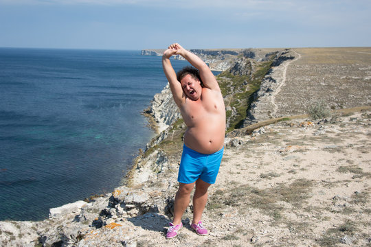 Summer And Sport. Funny Fat Man And Yoga. 