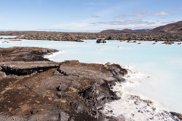 blue lagoon geothermal hot sea waters in cold volcanic lava