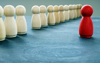Be unique and different. Red figurine is stand out from the crowd.