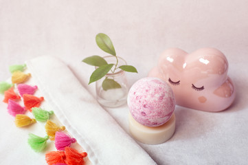 Fototapeta na wymiar Spa bath cosmetic. Soap beauty treatment background. Aromatherapy with natural salt and bath bomb.