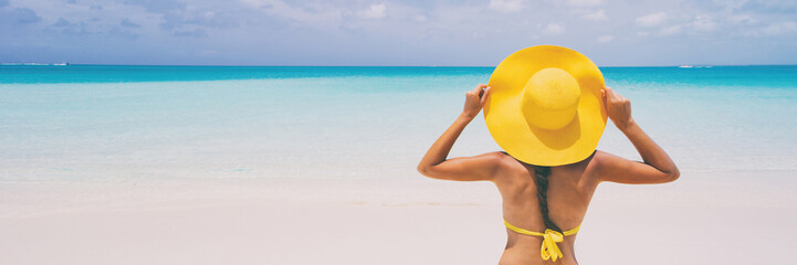 Luxury beach travel - Sexy woman sunbathing on the beach with bikini beach body. Beautiful multiracial Asian Caucasian female model on travel vacation holidays. SLOW MOTION. - 251213584