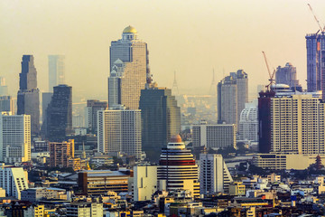 Bankkok, The capital of Thailand with building and skyscrapers in evening.