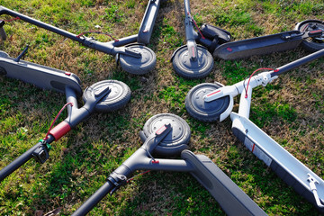 Fototapeta na wymiar electric scooters on a grass