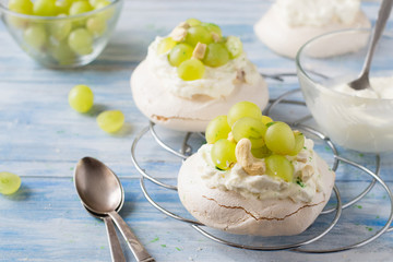 Grapes cream meringue on wooden table