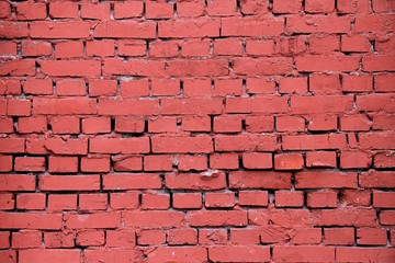 Red brick wall with plaster.