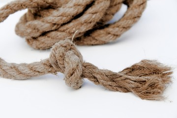 Rope with a knot is on a white background.