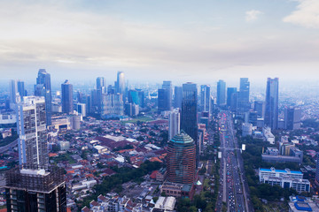 Fototapeta na wymiar Jakarta cityscape with skyscrapers at misty morning