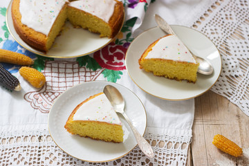 Traditional Romanian or Moldovan corn pie malay, with icing on a light background. Rustic style.