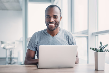 Young businessman working on his laptop in office.