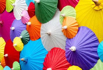 Fototapeta na wymiar Background of collorful traditional Asian paper umbrellas