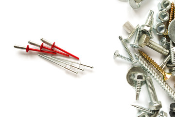 Flat lay of rivets white and colored isolated on white. Self Drilling screws. Isolated fasteners. Connecting material on white background
