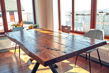 Interior of modern house, dining room with wooden table