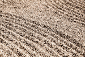 Pattern on sand in the rock garden