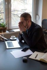 businessman working on laptop in office making phone call nervous and angry