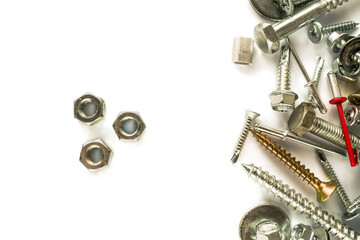 Flat lay of nuts isolated on white. Self Drilling screws. Isolated fasteners. Connecting material on white background