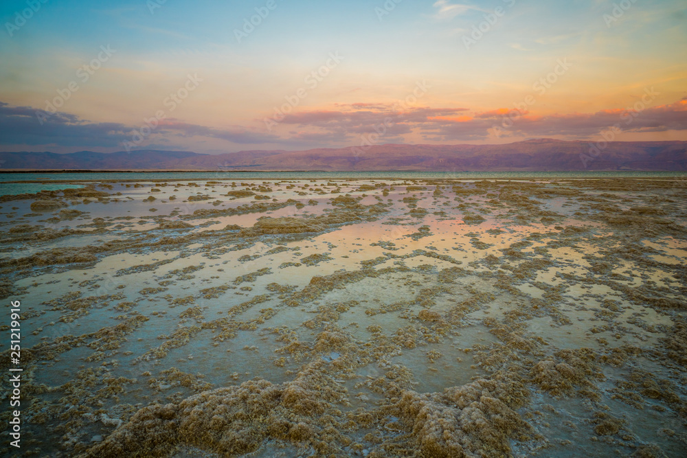 Wall mural sunset view of salt formations in the dead sea