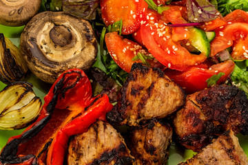 Grilled meat with vegetable on a plate