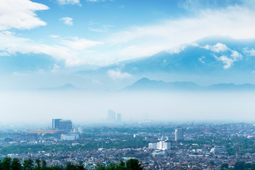 Wonderful Bandung cityscape with misty mountain