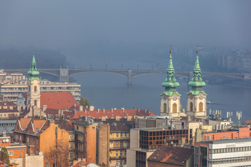 Naklejka na ściany i meble Aerial view of the Danube river in Budapest on foggy day