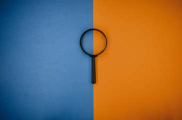 magnifying glass magnifying glass orange-blue background