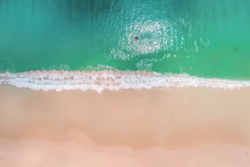 Foto op Plexiglas Aerial view of slim woman swimming on the swim ring  donut in the transparent turquoise sea in Seychelles. Summer seascape with girl, beautiful waves, colorful water. Top view from drone © gawriloff