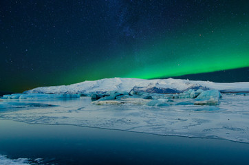 Frozen wonderland in scenic Iceland, with starry sky and northern lights