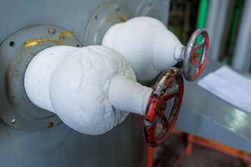 Metal valves on the pipes. Pipes and valves. Carbon dioxide production plant. Colorless gas. Gas...