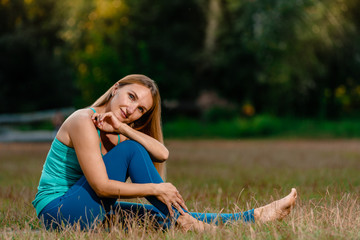 portrait of Beautiful young fit woman on nature