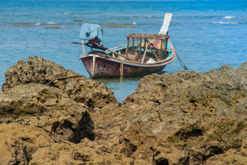 The boat parked by the sea