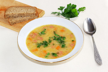 pea soup with greens in a white plate