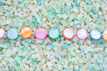 Colorful Pearl Beads on Crystals of Aromatic Bath Sea Salt for Spa