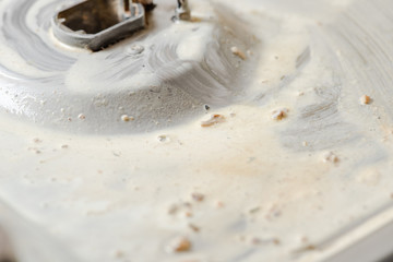 Detergent soap on a dirty gas stove.