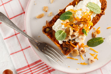 carrot fruit cake with nuts and cream