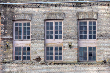 Old wooden Windows of an old brick house